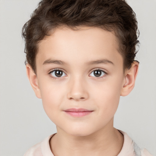 Joyful white child male with short  brown hair and brown eyes