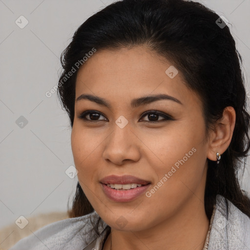 Joyful latino young-adult female with medium  brown hair and brown eyes