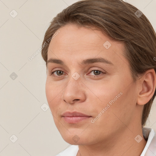 Joyful white adult female with medium  brown hair and brown eyes