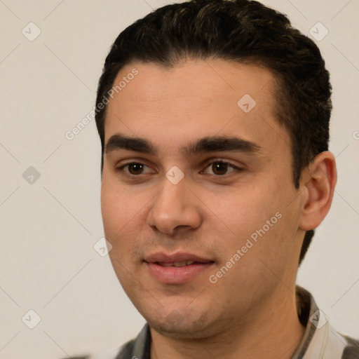 Joyful white young-adult male with short  black hair and brown eyes