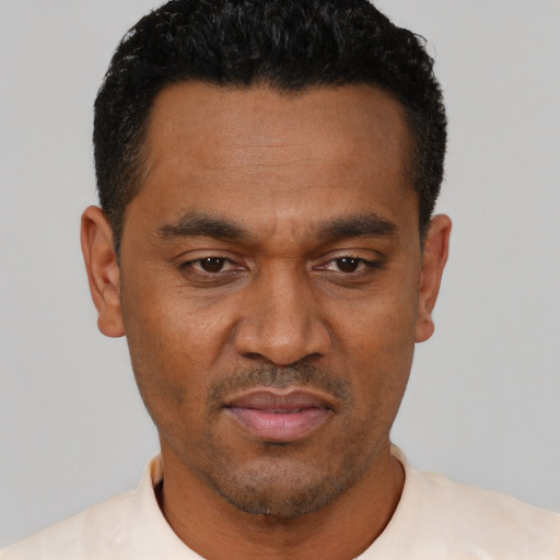 Neutral latino young-adult male with short  brown hair and brown eyes