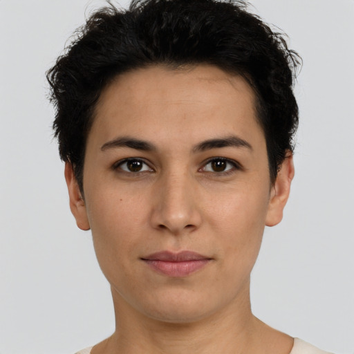 Joyful latino young-adult female with short  black hair and brown eyes