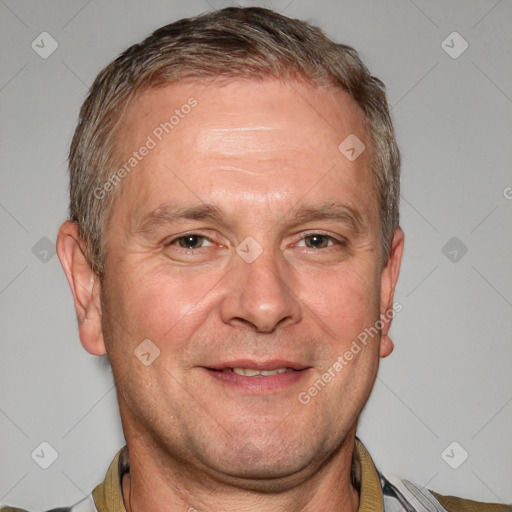 Joyful white adult male with short  brown hair and grey eyes