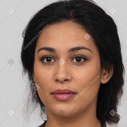 Joyful latino young-adult female with long  brown hair and brown eyes