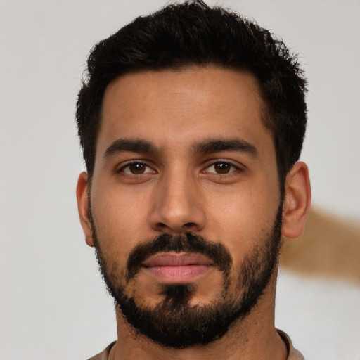 Neutral latino young-adult male with short  black hair and brown eyes
