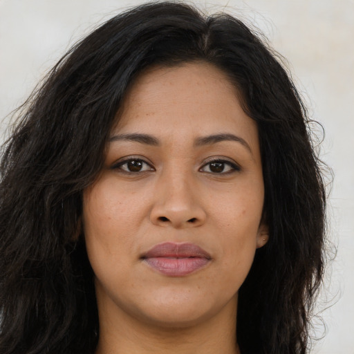 Joyful asian young-adult female with long  brown hair and brown eyes