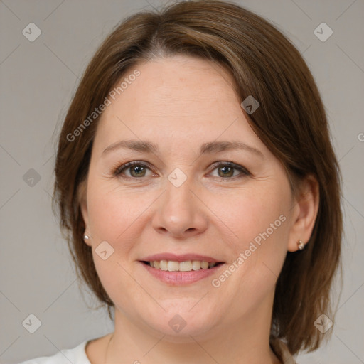 Joyful white young-adult female with medium  brown hair and green eyes