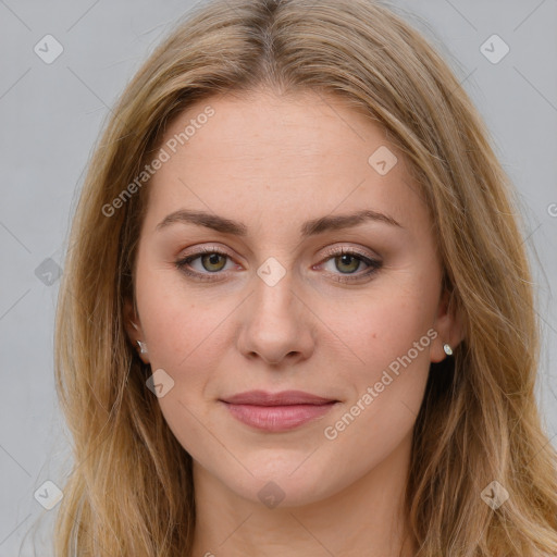 Joyful white young-adult female with long  brown hair and blue eyes