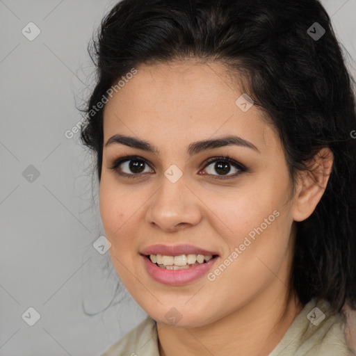 Joyful latino young-adult female with medium  brown hair and brown eyes