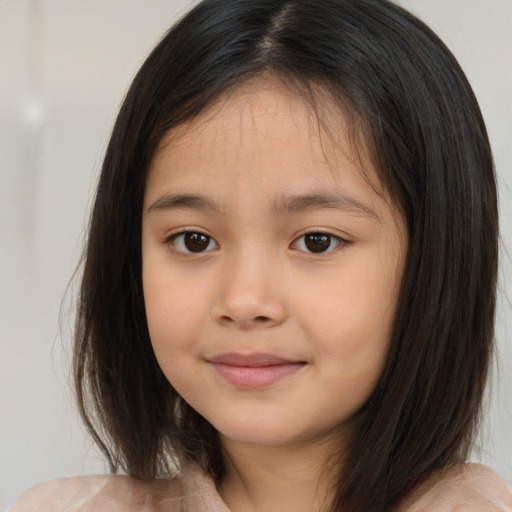 Joyful white child female with medium  brown hair and brown eyes