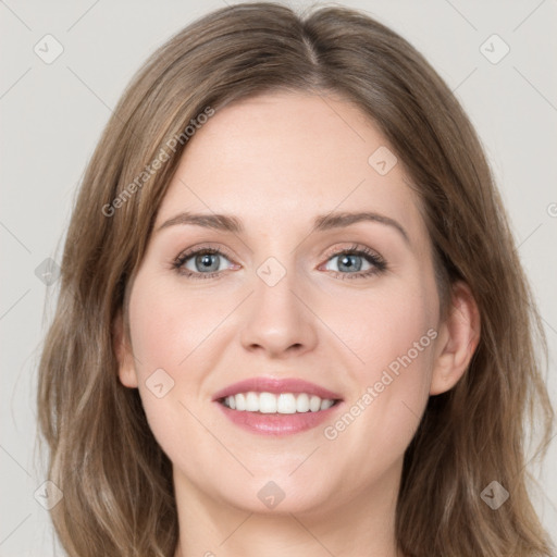 Joyful white young-adult female with medium  brown hair and green eyes