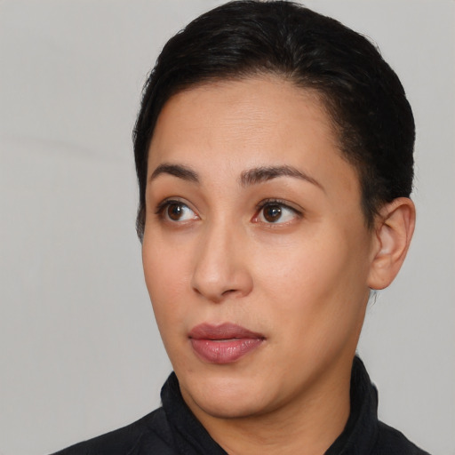 Joyful white young-adult female with short  black hair and brown eyes
