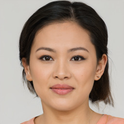 Joyful white young-adult female with medium  brown hair and brown eyes