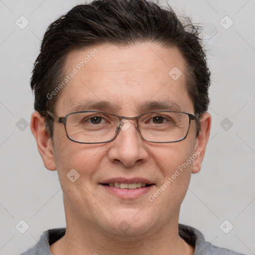 Joyful white adult male with short  brown hair and grey eyes