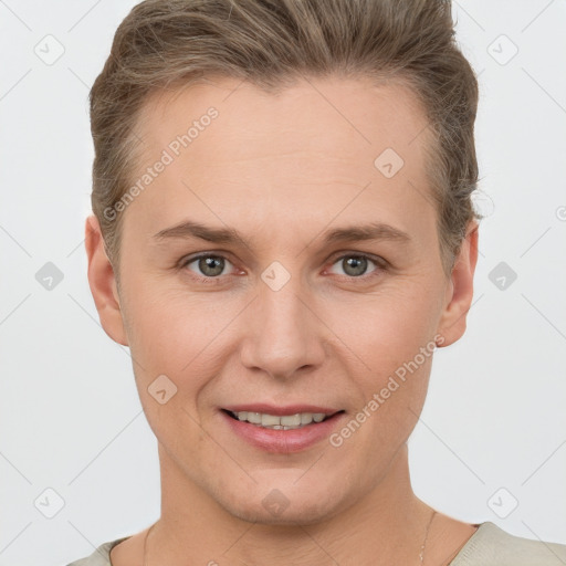 Joyful white young-adult female with short  brown hair and grey eyes