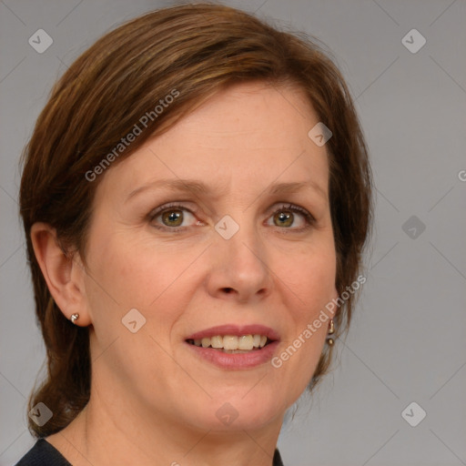 Joyful white adult female with medium  brown hair and blue eyes