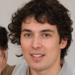 Joyful white young-adult male with medium  brown hair and brown eyes