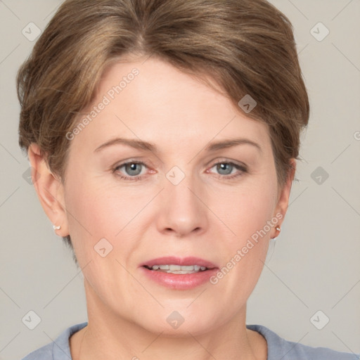 Joyful white adult female with short  brown hair and grey eyes