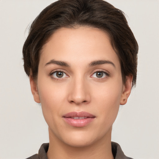 Neutral white young-adult female with short  brown hair and brown eyes