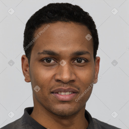 Joyful black young-adult male with short  black hair and brown eyes