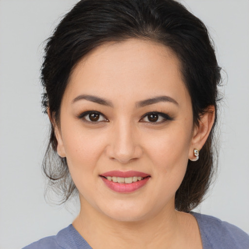 Joyful white young-adult female with medium  brown hair and brown eyes