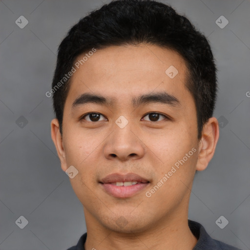 Joyful asian young-adult male with short  black hair and brown eyes