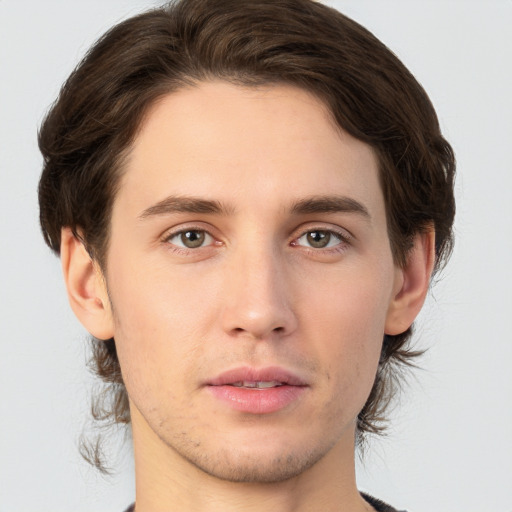 Neutral white young-adult male with medium  brown hair and brown eyes