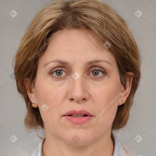 Joyful white adult female with medium  brown hair and grey eyes