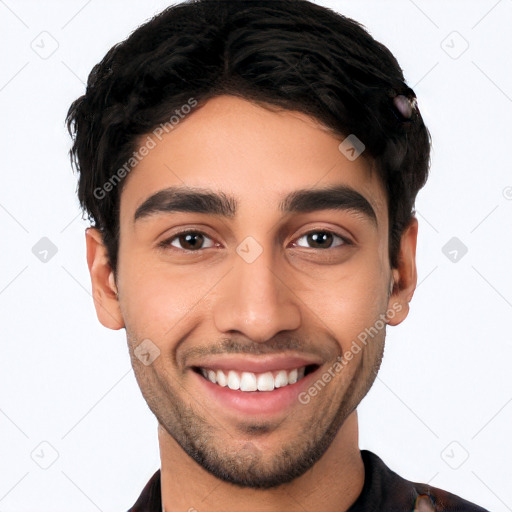 Joyful white young-adult male with short  black hair and brown eyes