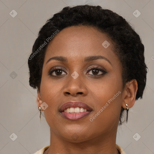 Joyful black young-adult female with short  brown hair and brown eyes