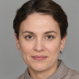 Joyful white adult female with short  brown hair and brown eyes