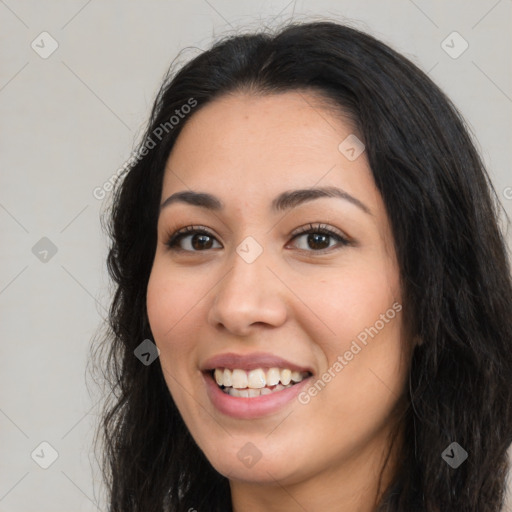 Joyful latino young-adult female with long  black hair and brown eyes