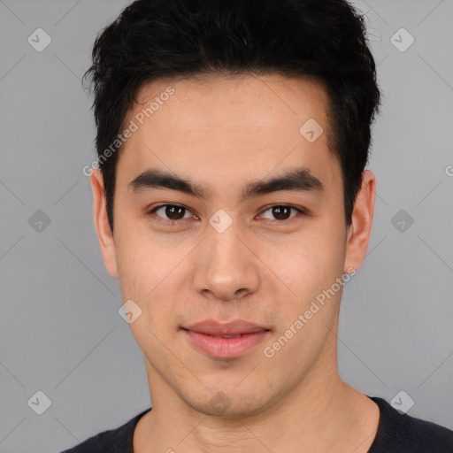 Joyful asian young-adult male with short  black hair and brown eyes