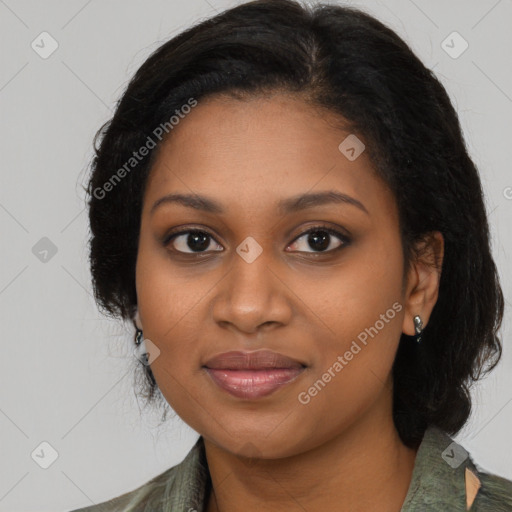 Joyful black young-adult female with long  brown hair and brown eyes