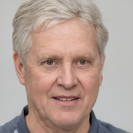 Joyful white middle-aged male with short  gray hair and grey eyes