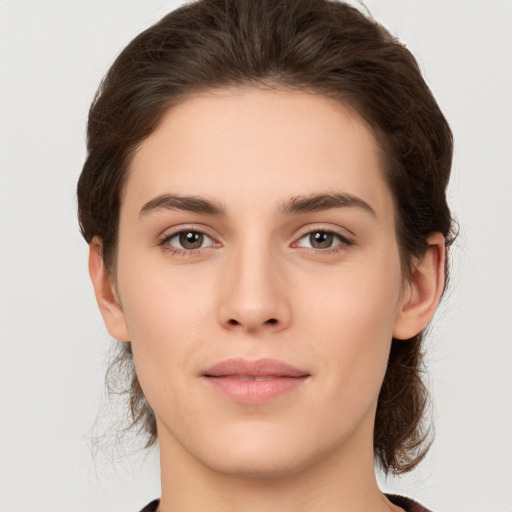 Neutral white young-adult female with medium  brown hair and brown eyes