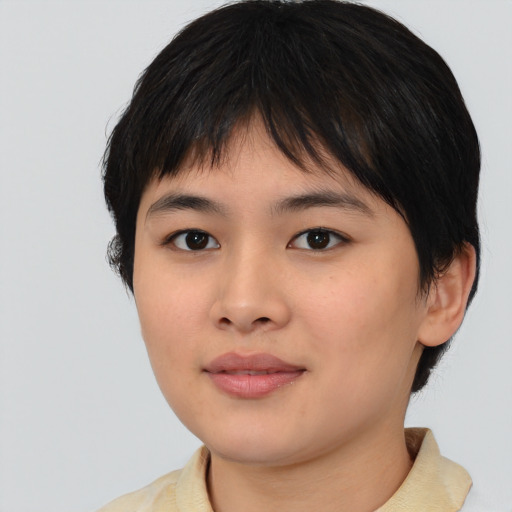 Joyful asian young-adult female with short  black hair and brown eyes
