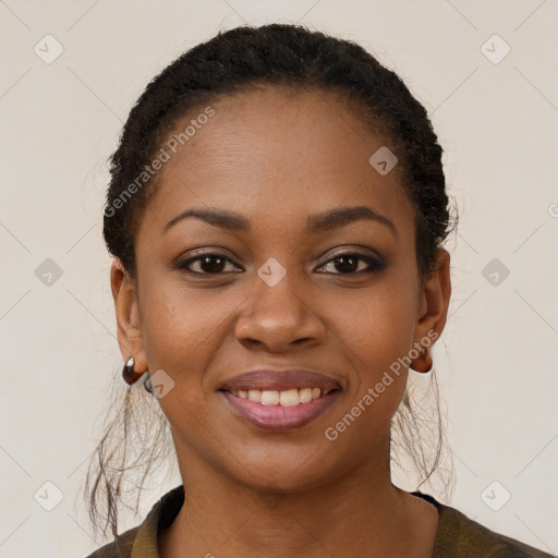 Joyful black young-adult female with short  brown hair and brown eyes