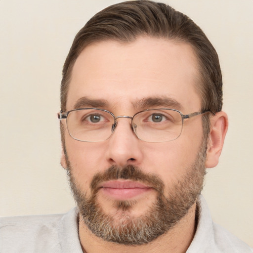 Joyful white adult male with short  brown hair and brown eyes