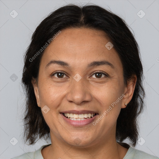 Joyful white adult female with medium  brown hair and brown eyes