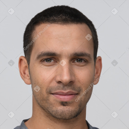 Joyful white young-adult male with short  brown hair and brown eyes