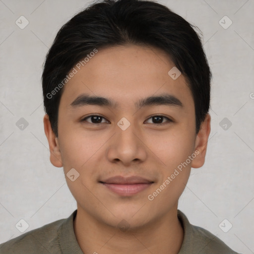 Joyful asian young-adult male with short  black hair and brown eyes