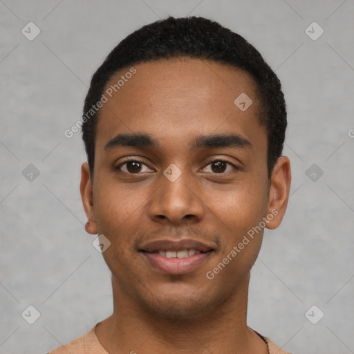 Joyful black young-adult male with short  black hair and brown eyes