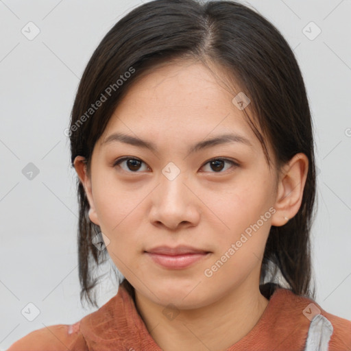 Joyful asian young-adult female with medium  brown hair and brown eyes