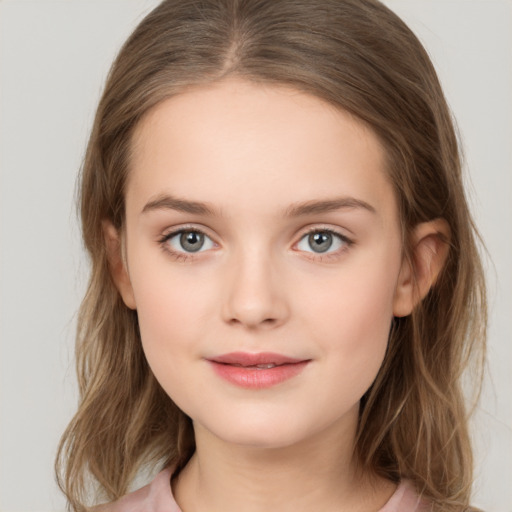 Joyful white child female with long  brown hair and brown eyes