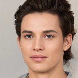 Joyful white young-adult male with medium  brown hair and brown eyes