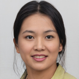 Joyful asian young-adult female with medium  brown hair and brown eyes