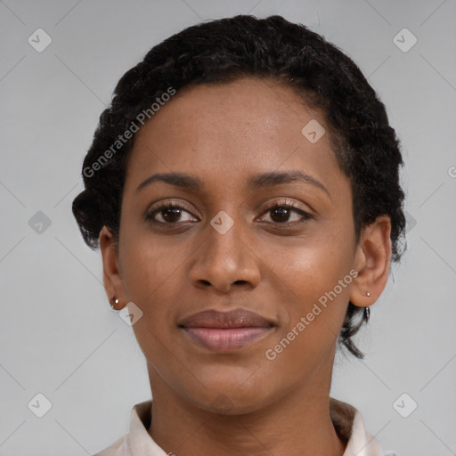 Joyful black young-adult female with short  brown hair and brown eyes