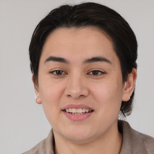 Joyful white young-adult female with medium  brown hair and brown eyes