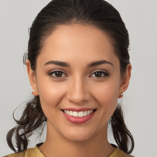 Joyful white young-adult female with medium  brown hair and brown eyes